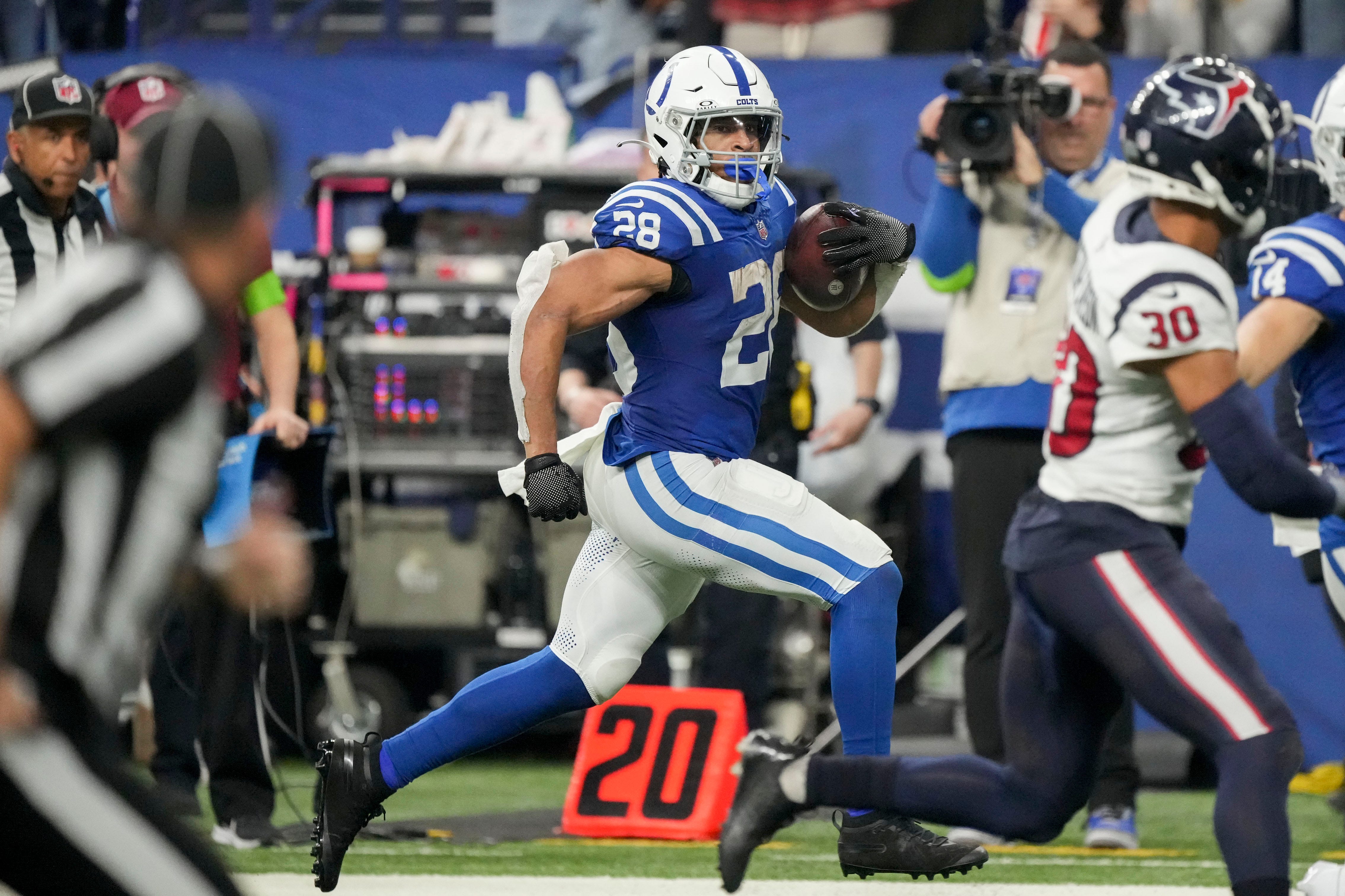 Indianapolis Colts running back Jonathan Taylor (28) rushes along the sideline Saturday, Jan. 6, 2024, during a game against the Houston Texans at Lucas Oil Stadium in Indianapolis. Robert Scheer/IndyStar / USA TODAY NETWORK